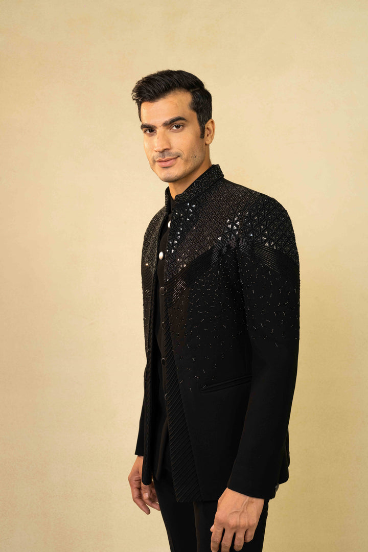 Black Jodhpuri suit featuring refined pin-tuck detailing and metallic embroidery