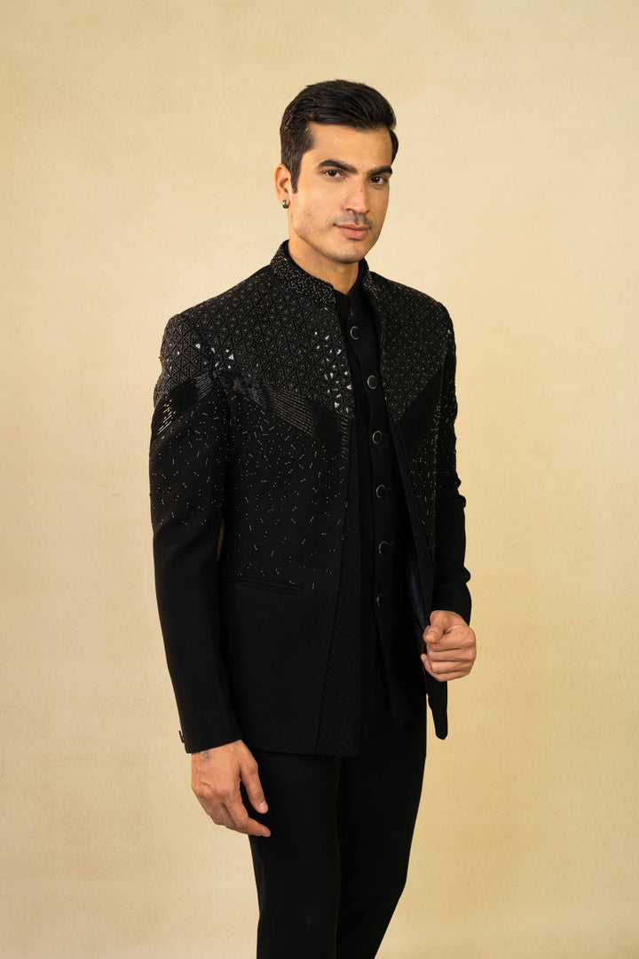Black Jodhpuri suit featuring refined pin-tuck detailing and metallic embroidery