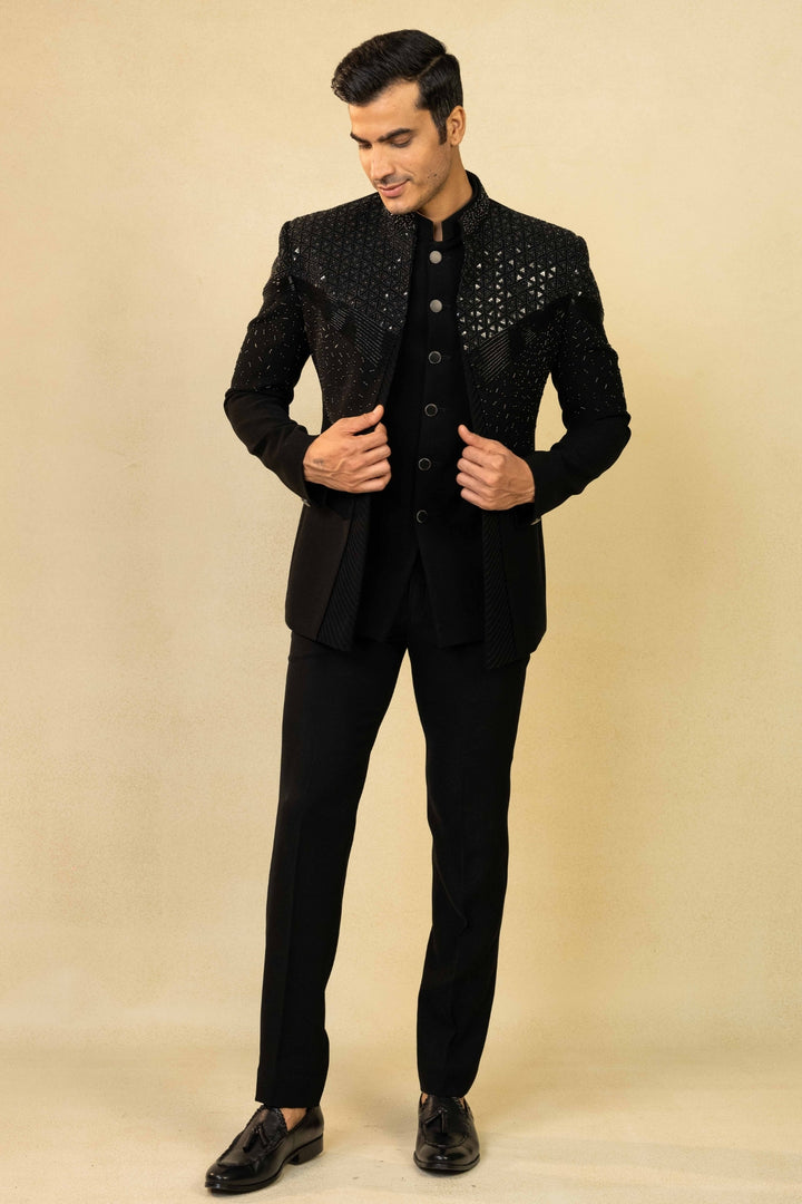 Black Jodhpuri suit featuring refined pin-tuck detailing and metallic embroidery
