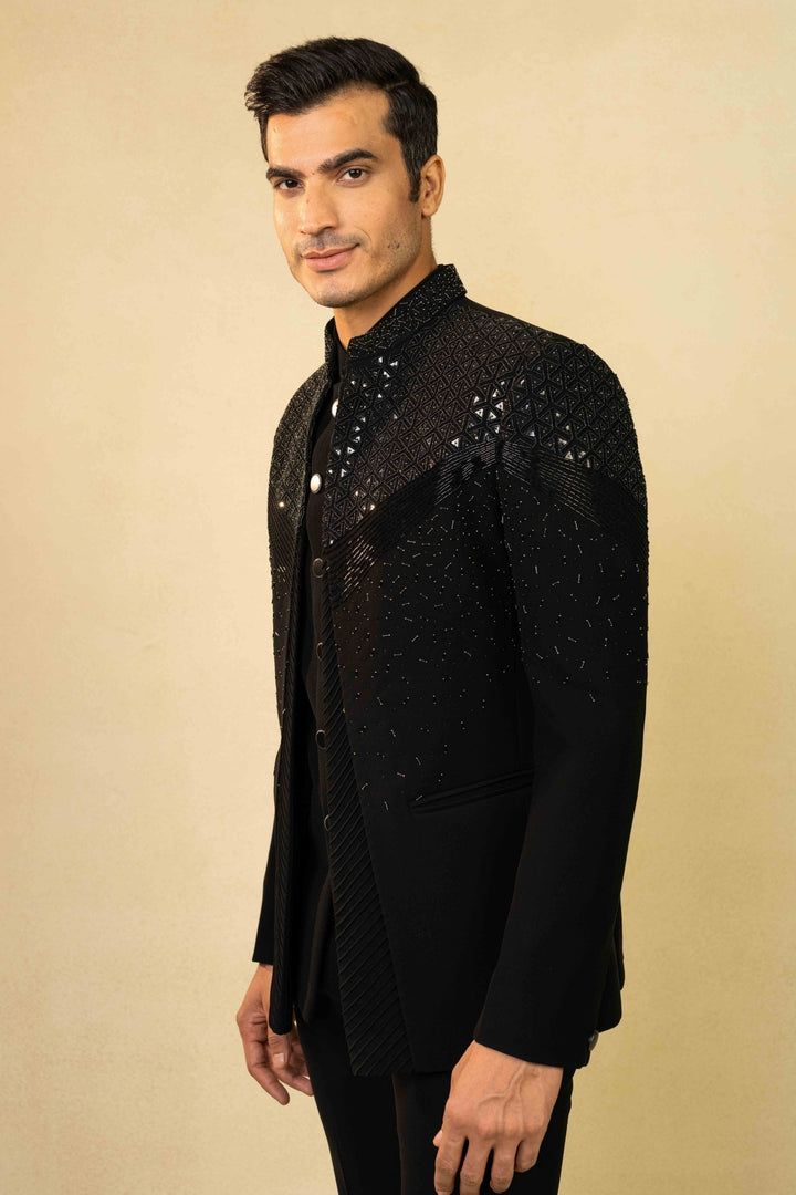 Black Jodhpuri suit featuring refined pin-tuck detailing and metallic embroidery