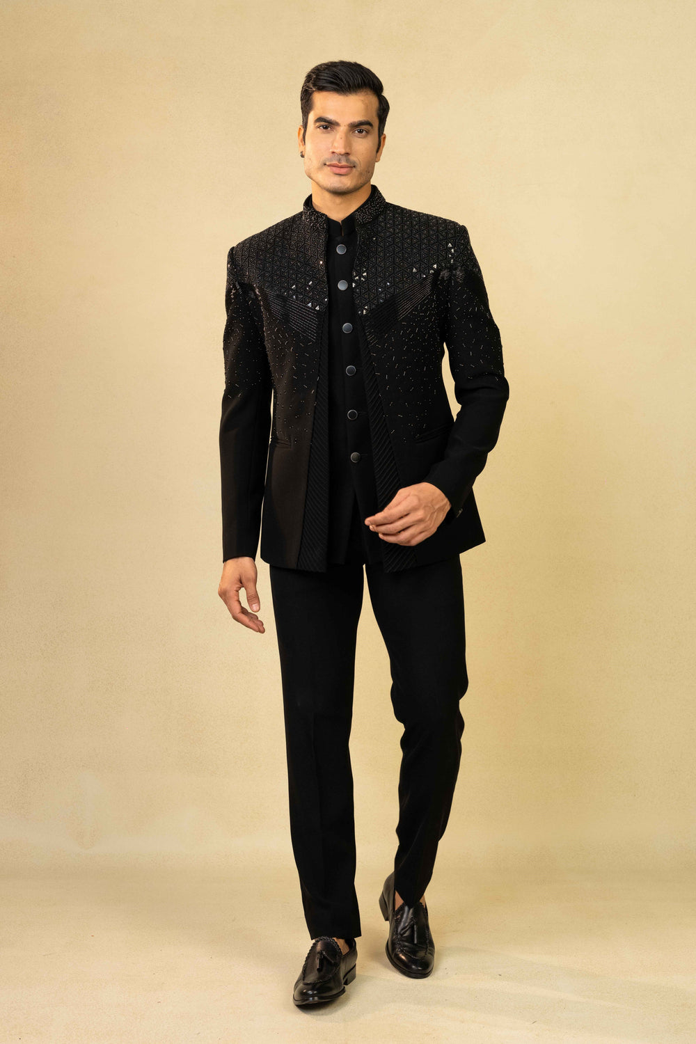 Black Jodhpuri suit featuring refined pin-tuck detailing and metallic embroidery