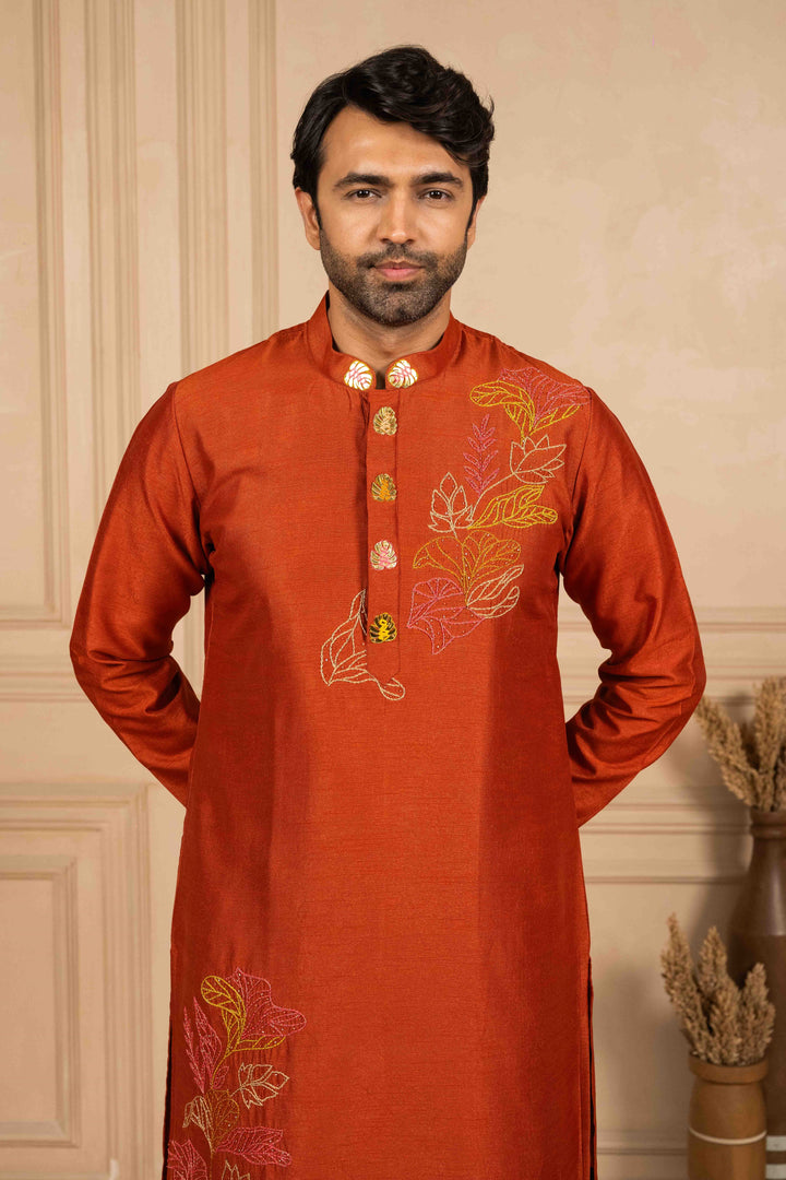 Burnt orange kurta adorned with Reshamkari embroidery