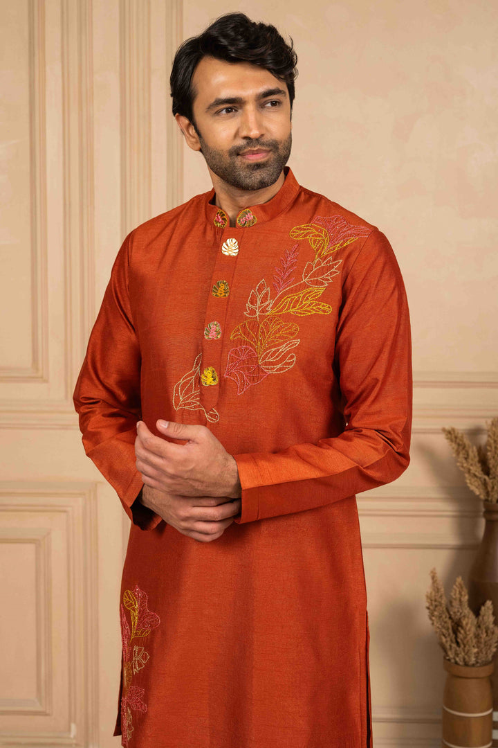 Burnt orange kurta adorned with Reshamkari embroidery