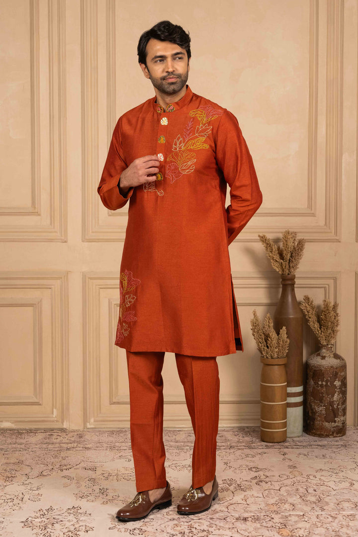 Burnt orange kurta adorned with Reshamkari embroidery