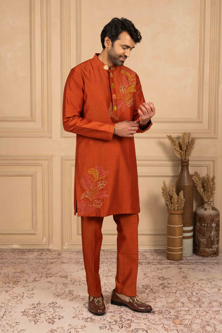 Burnt orange kurta adorned with Reshamkari embroidery