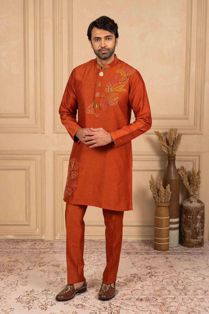 Burnt orange kurta adorned with Reshamkari embroidery