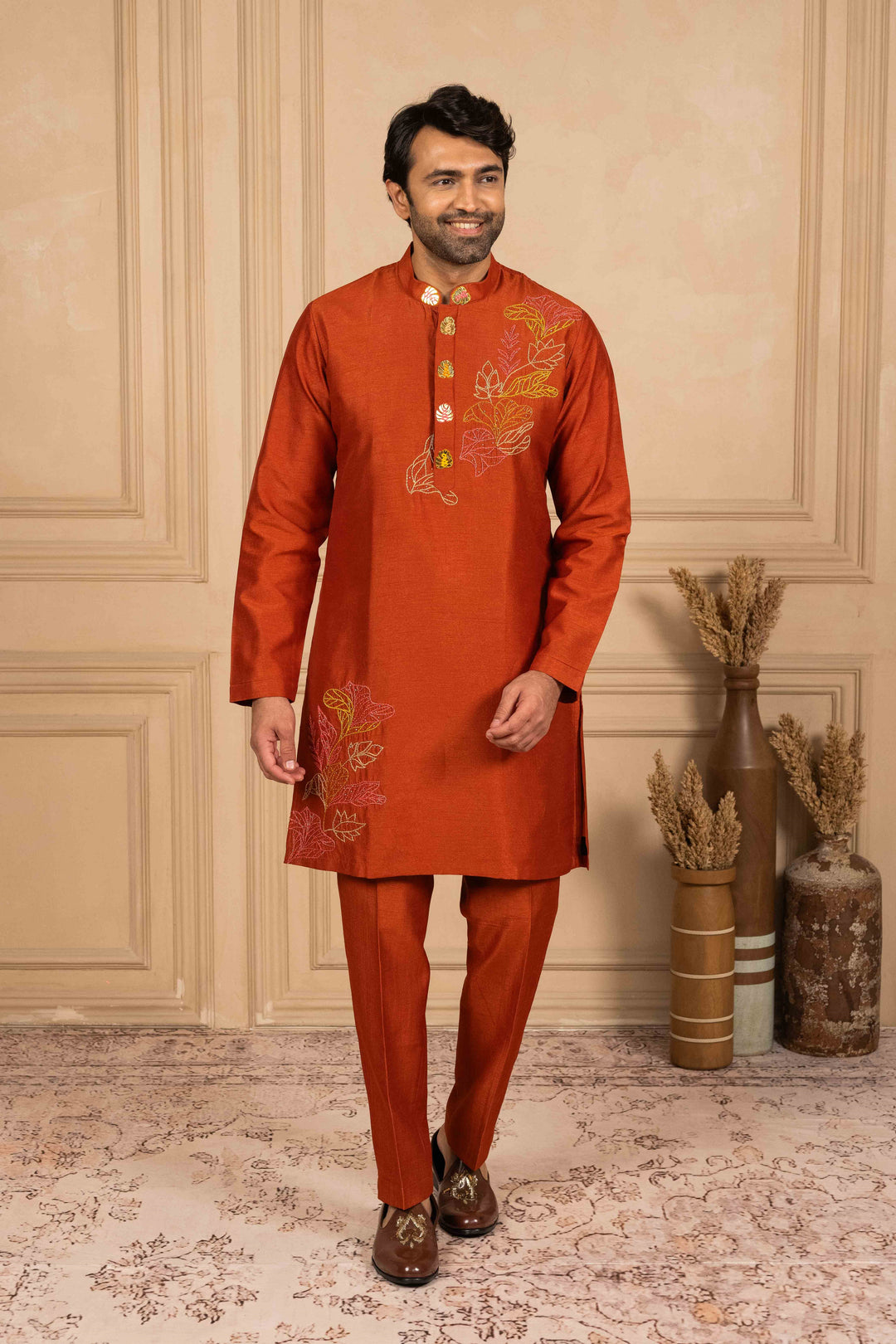 Burnt orange kurta adorned with Reshamkari embroidery