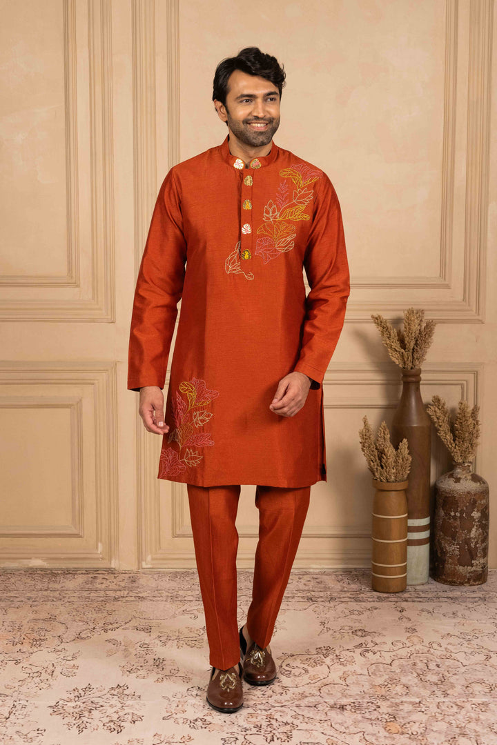 Burnt orange kurta adorned with Reshamkari embroidery