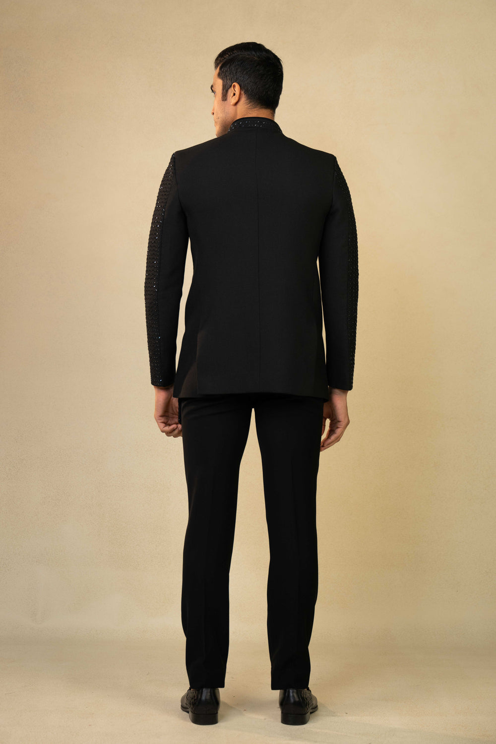 a black jodhpuri with hand embroidery