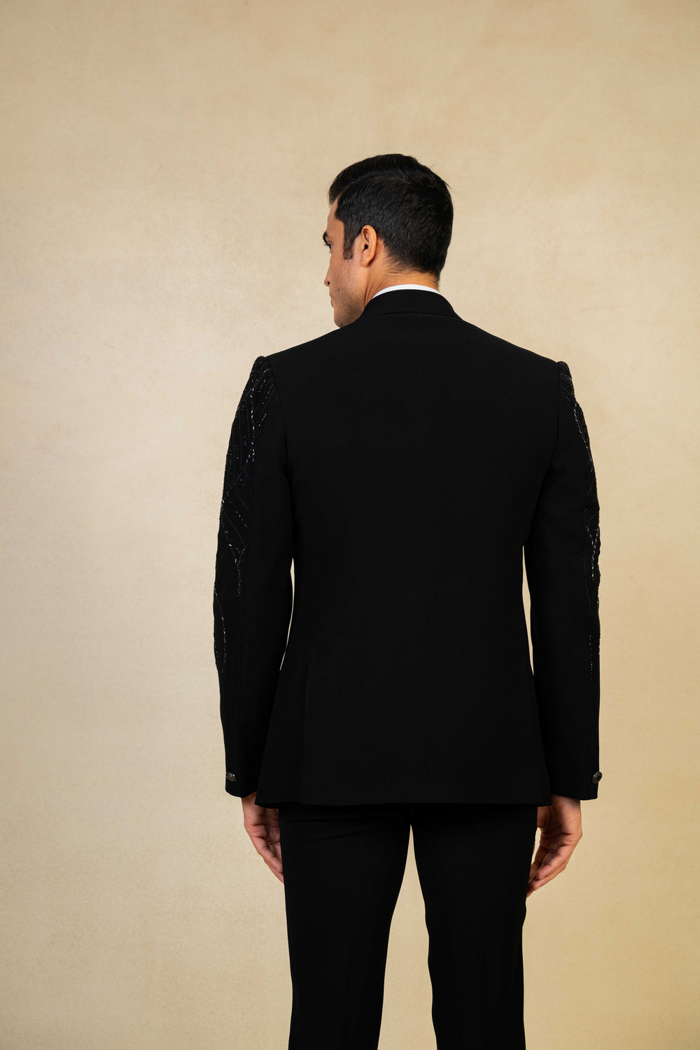 a black tuxedo with hand embroidery