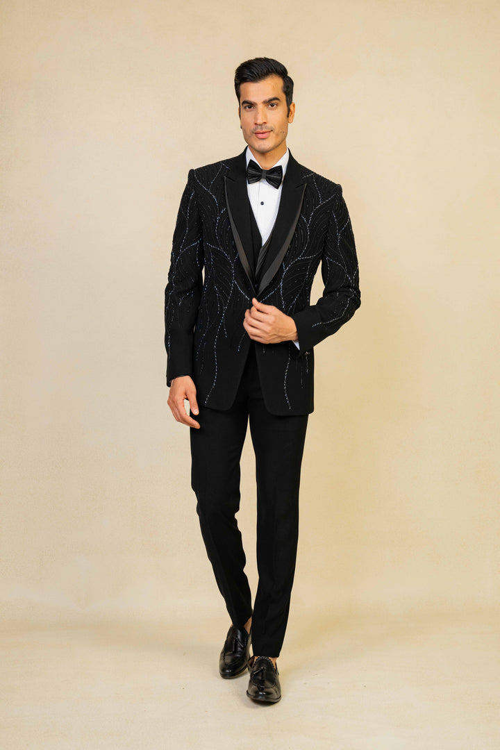 a black tuxedo with hand embroidery