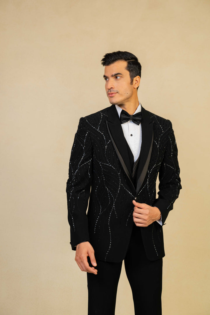 a black tuxedo with hand embroidery