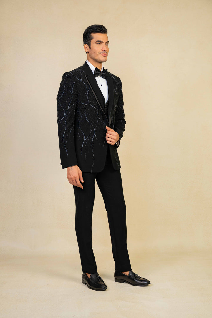 a black tuxedo with hand embroidery