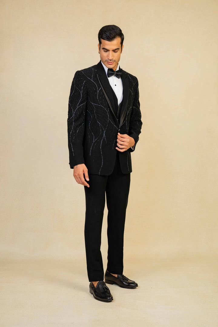 a black tuxedo with hand embroidery