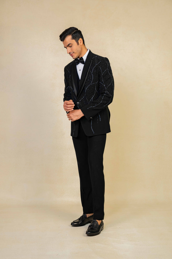 a black tuxedo with hand embroidery