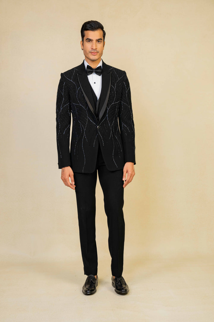 a black tuxedo with hand embroidery