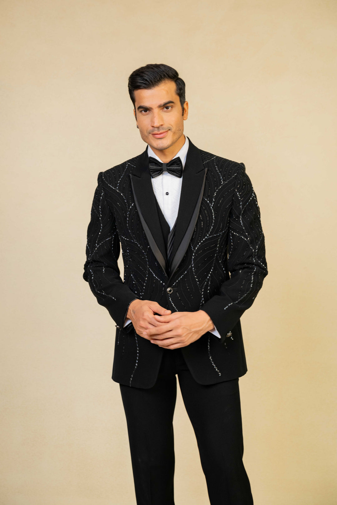 a black tuxedo with hand embroidery