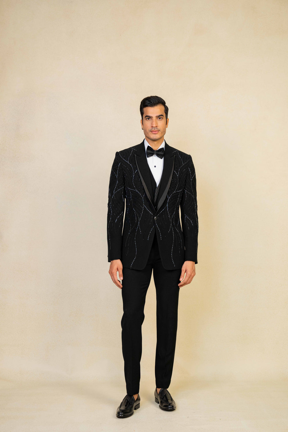 a black tuxedo with hand embroidery