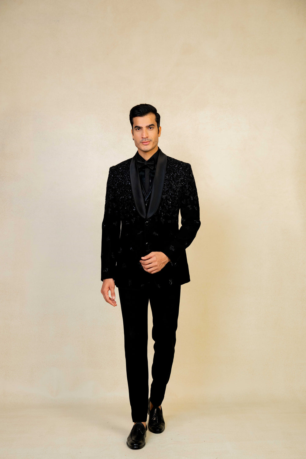 a blacktuxedo with abstract geometric embroidery