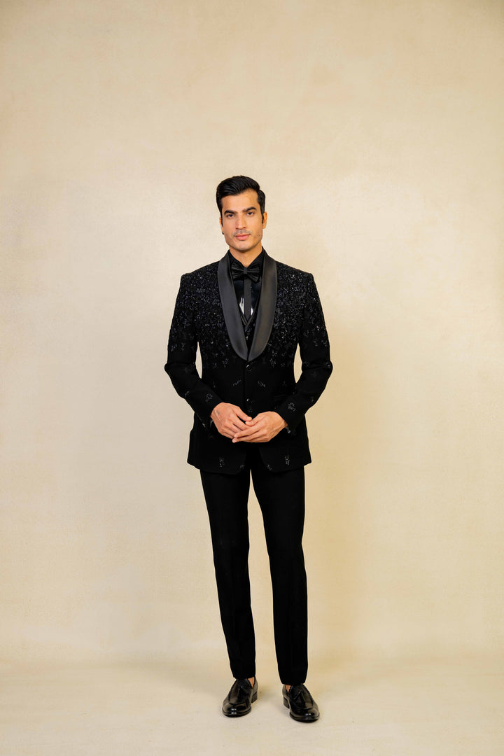 a blacktuxedo with abstract geometric embroidery