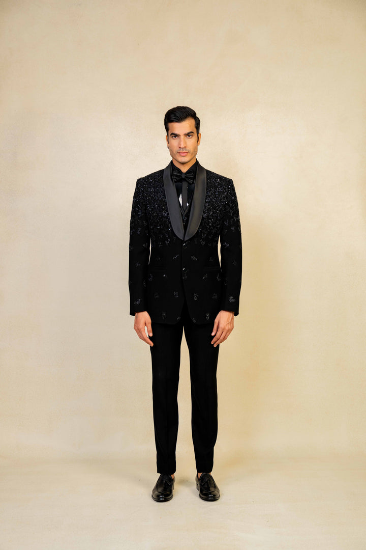 a blacktuxedo with abstract geometric embroidery