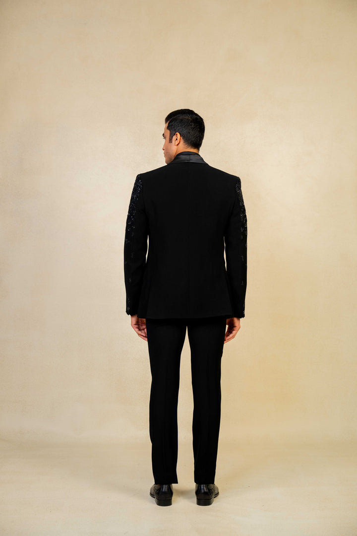 a blacktuxedo with abstract geometric embroidery