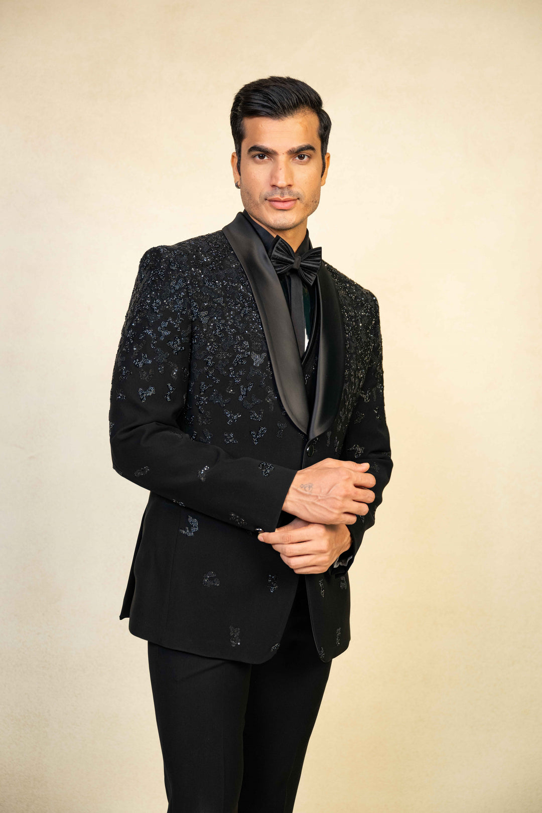 a blacktuxedo with abstract geometric embroidery