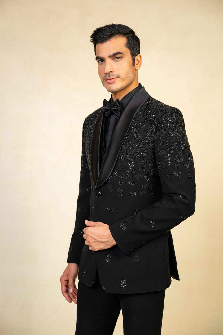 a blacktuxedo with abstract geometric embroidery