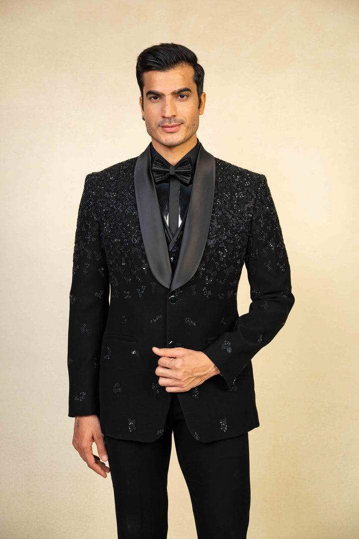a blacktuxedo with abstract geometric embroidery