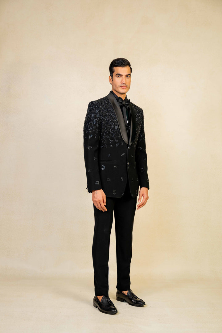 a blacktuxedo with abstract geometric embroidery
