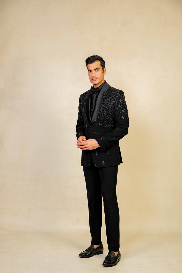 a blacktuxedo with abstract geometric embroidery